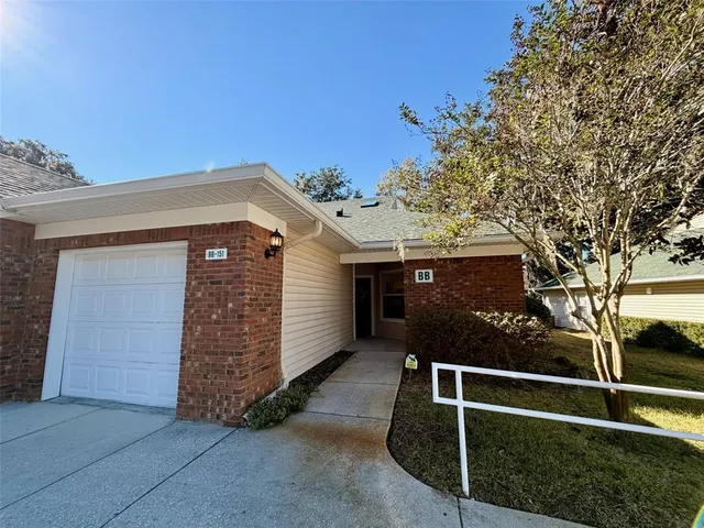 a front view of a house with stairs