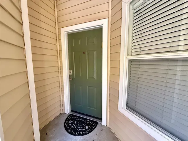 a view of a door and a window