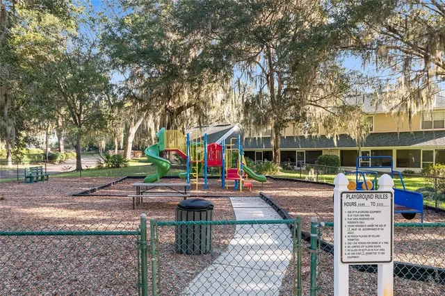 a living room with furniture a window and a table