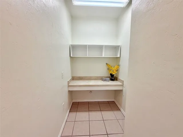 a view of a small room with a bench