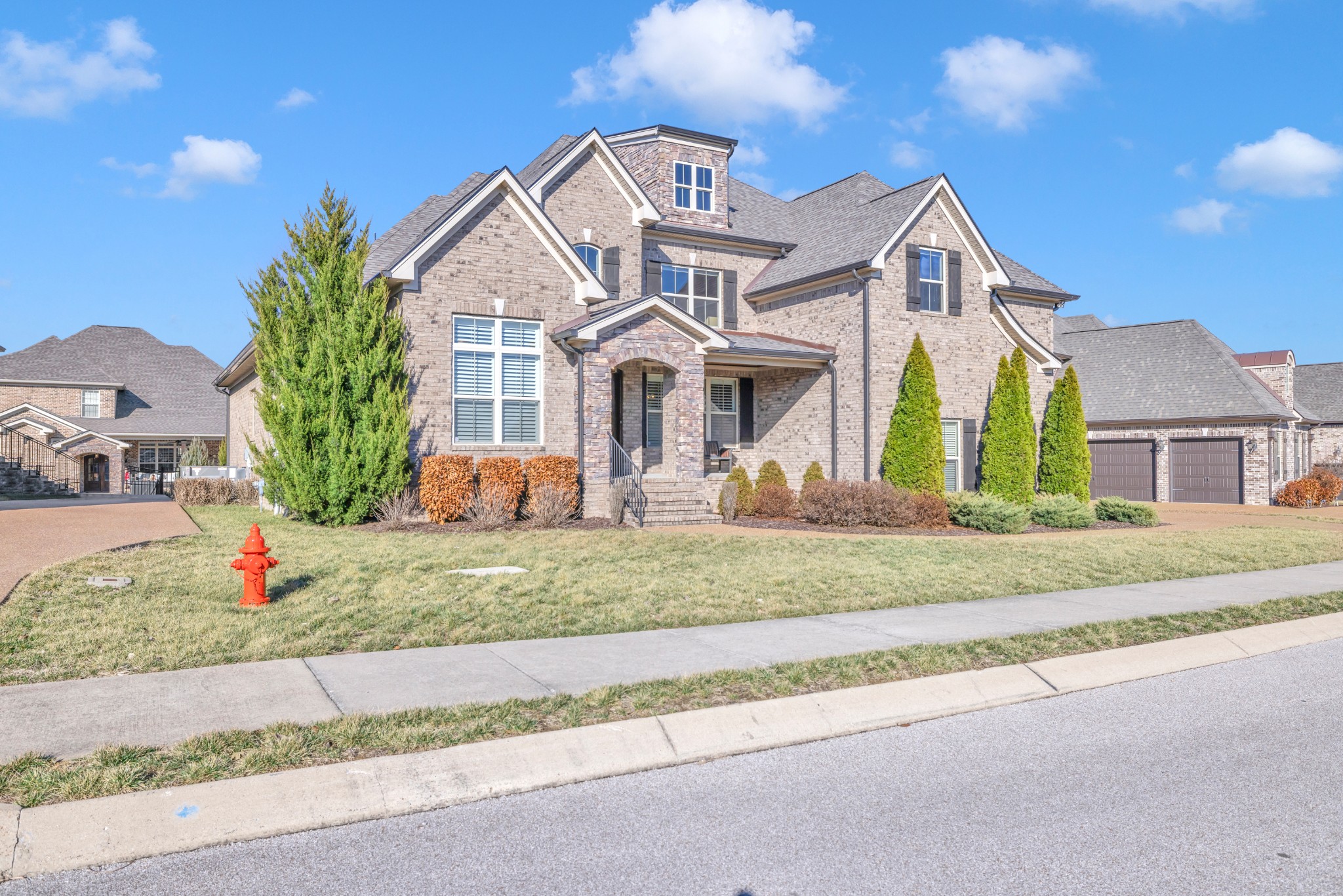4008 Canberra Drive Spring Hill, TN 37174 - Photo 2 of 63 a front view of a house with a yard and garage