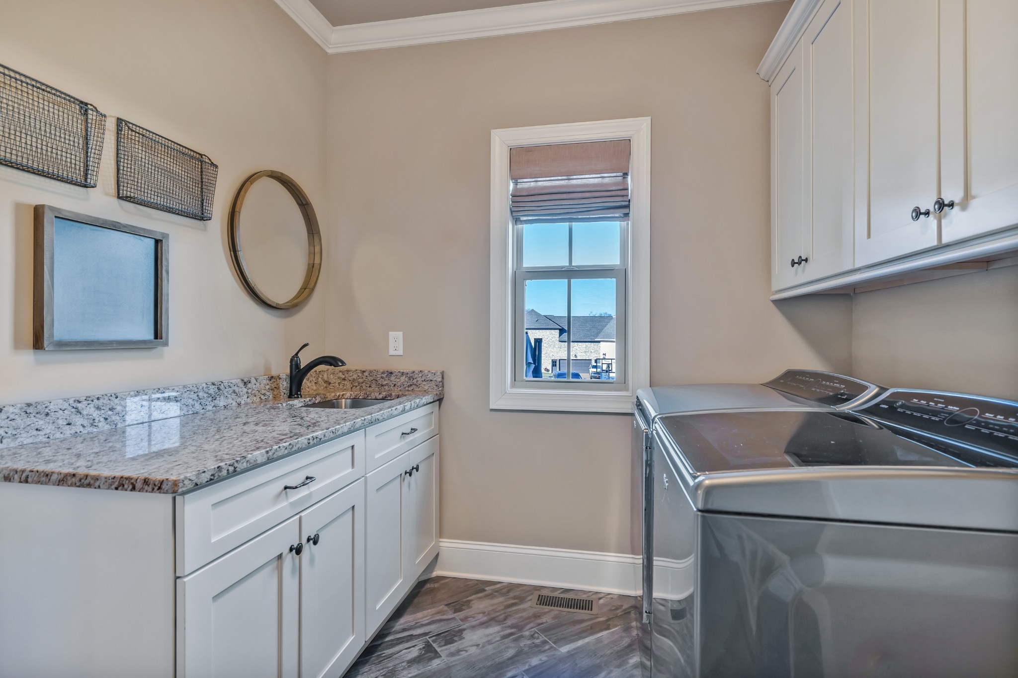 4008 Canberra Drive Spring Hill, TN 37174 - Photo 35 of 63 a bathroom with a granite countertop sink a mirror and cabinets