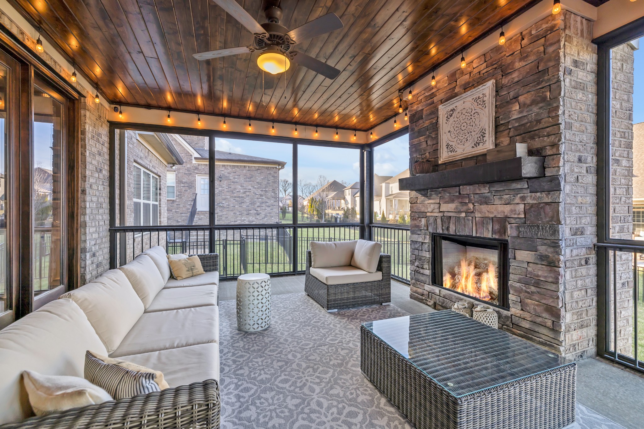 4008 Canberra Drive Spring Hill, TN 37174 - Photo 58 of 63 a living room with furniture a fireplace and a large window
