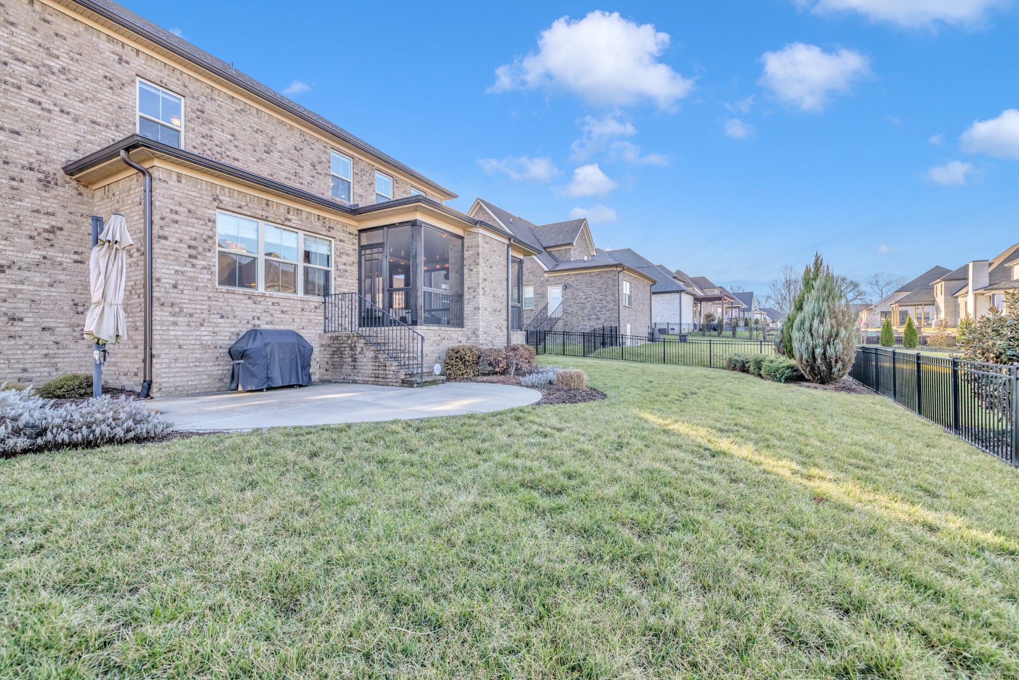 4008 Canberra Drive Spring Hill, TN 37174 - Photo 61 of 63 a front view of a house with a yard and outdoor seating