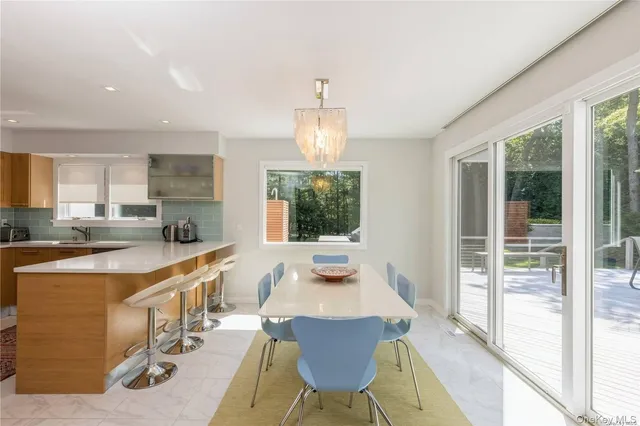 a dining room with furniture window wooden floor