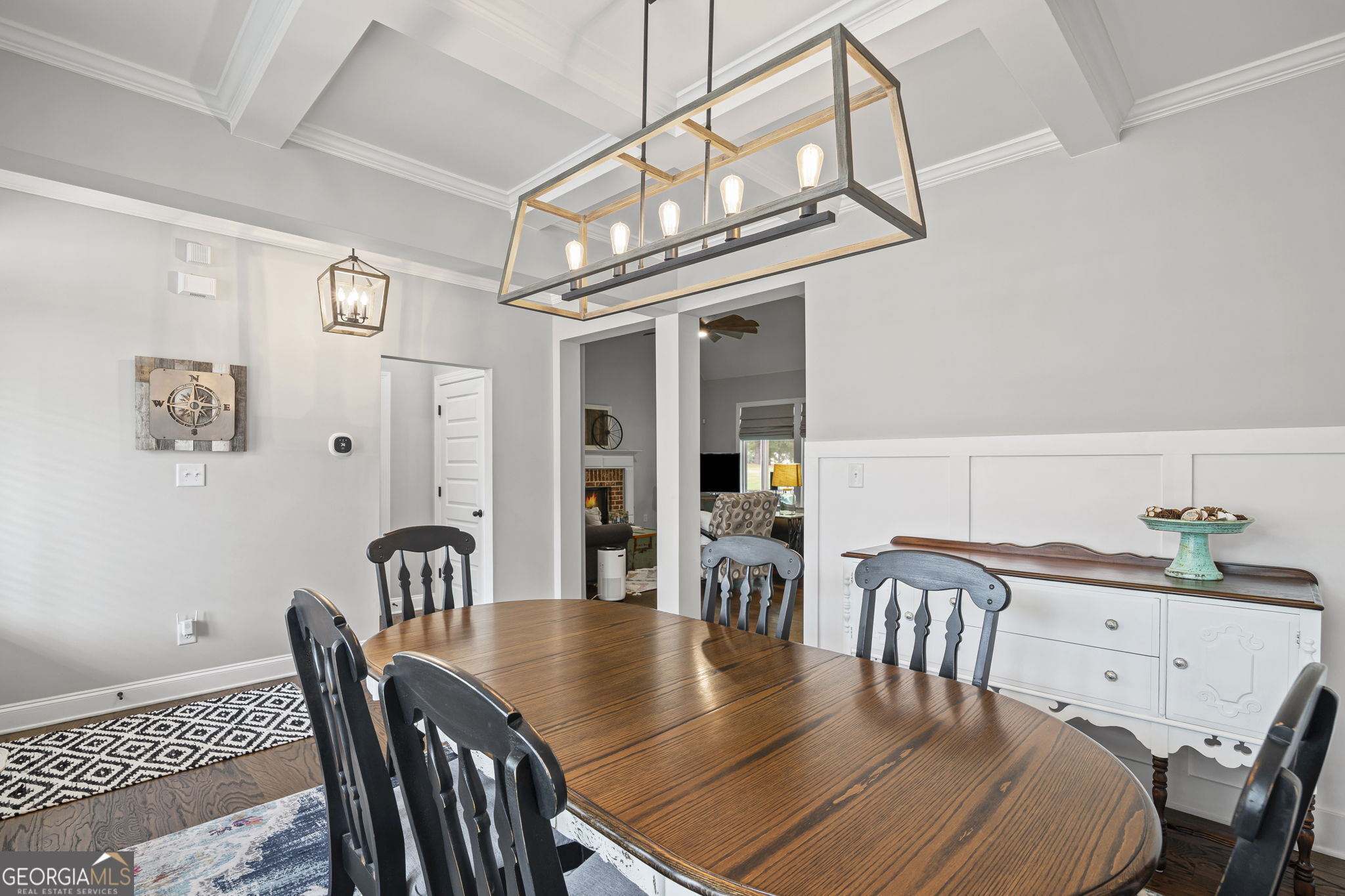 150 Duck Drive Senoia, GA 30276 - Photo 12 of 73 a view of a dining room with furniture a chandelier and wooden floor