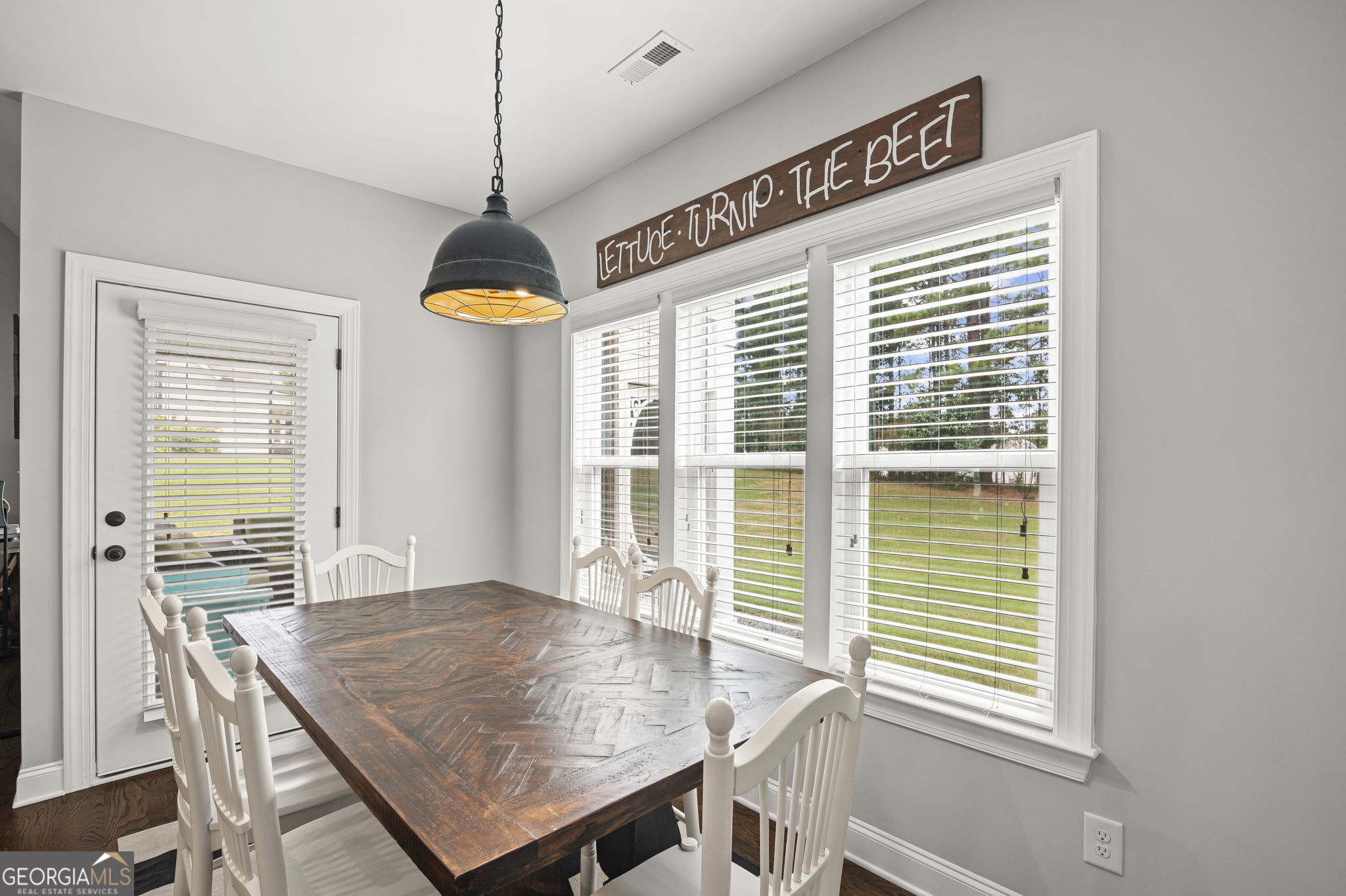 150 Duck Drive Senoia, GA 30276 - Photo 23 of 73 a dining room with furniture window wooden floor