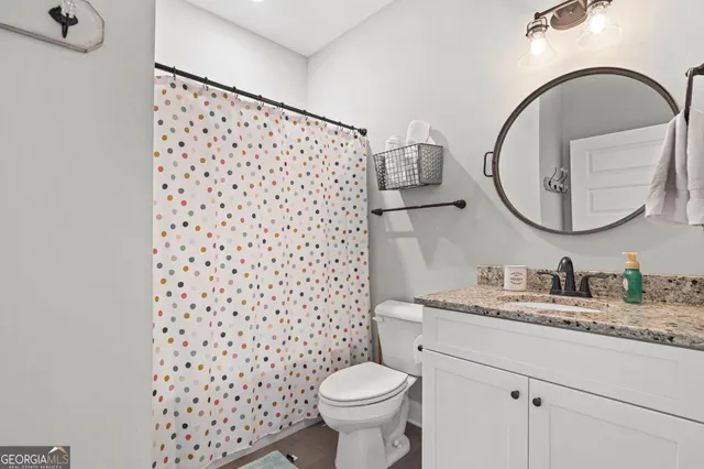 a view of a livingroom with furniture and a window