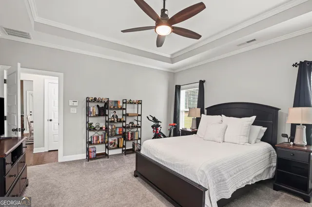 a spacious bathroom with a granite countertop sink and a mirror