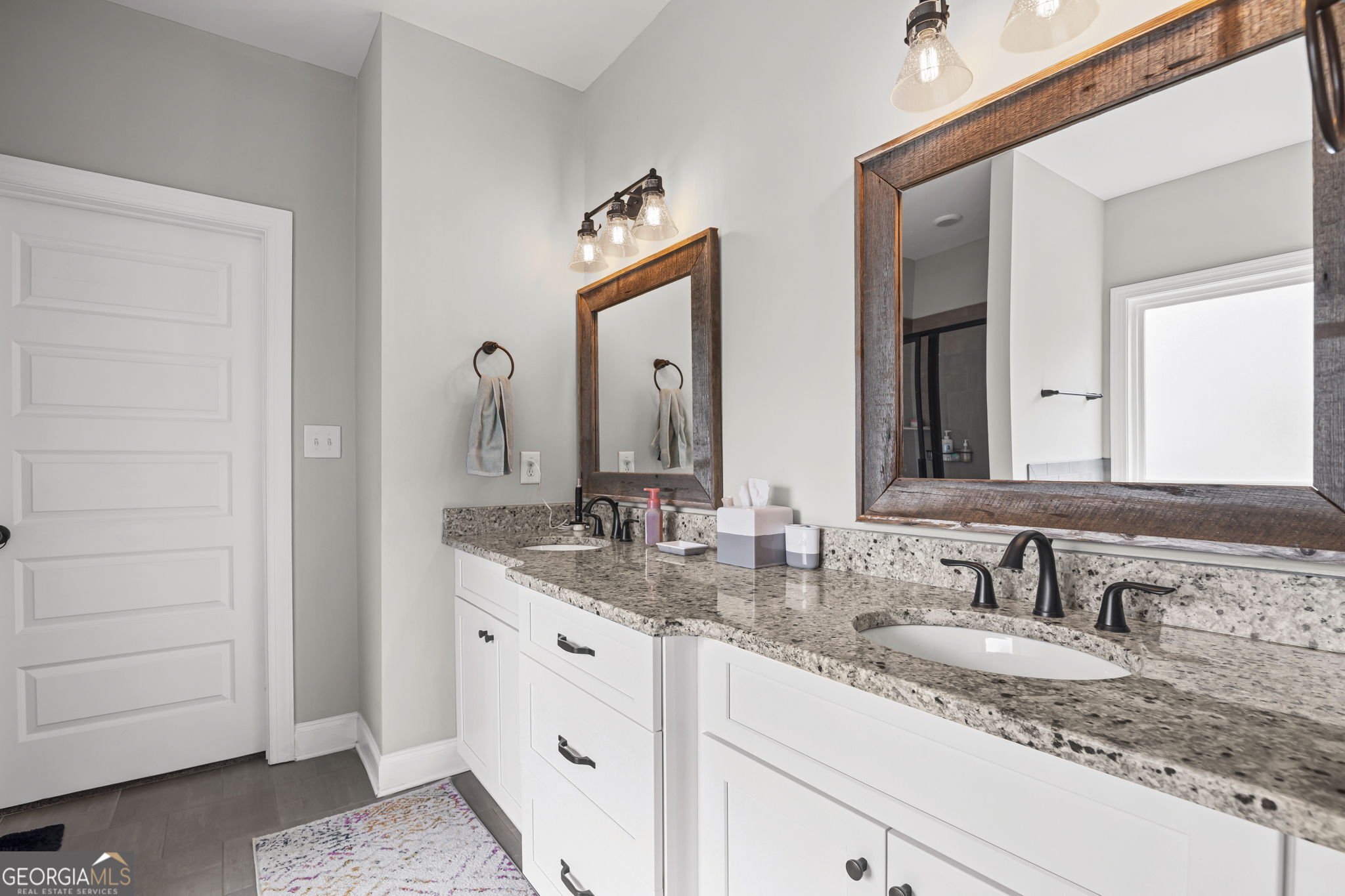 150 Duck Drive Senoia, GA 30276 - Photo 30 of 73 a bathroom with double sink and a mirror