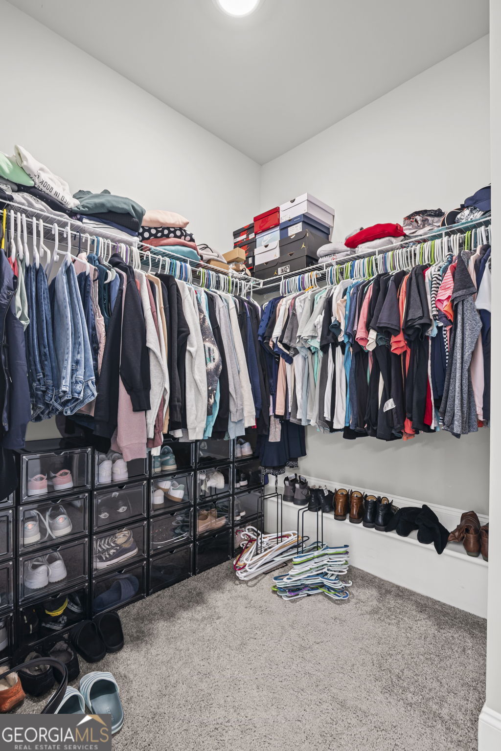 150 Duck Drive Senoia, GA 30276 - Photo 34 of 73 a view of walk in closet with clothes and shoes