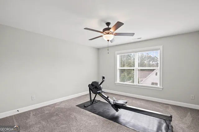 an aerial view of residential houses with outdoor space and parked