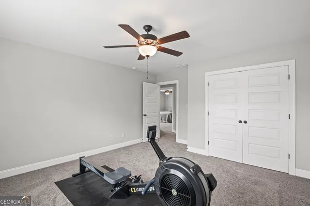 an aerial view of a house with a garden and houses