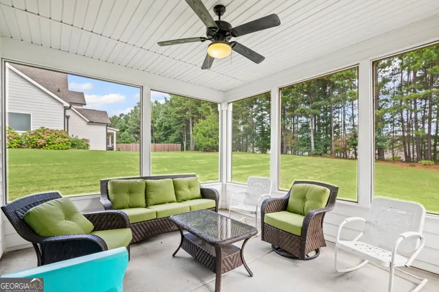 an aerial view of a house with garden space ocean view