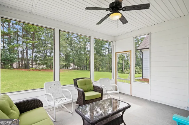 an aerial view of a house with a swimming pool yard and mountain view in back