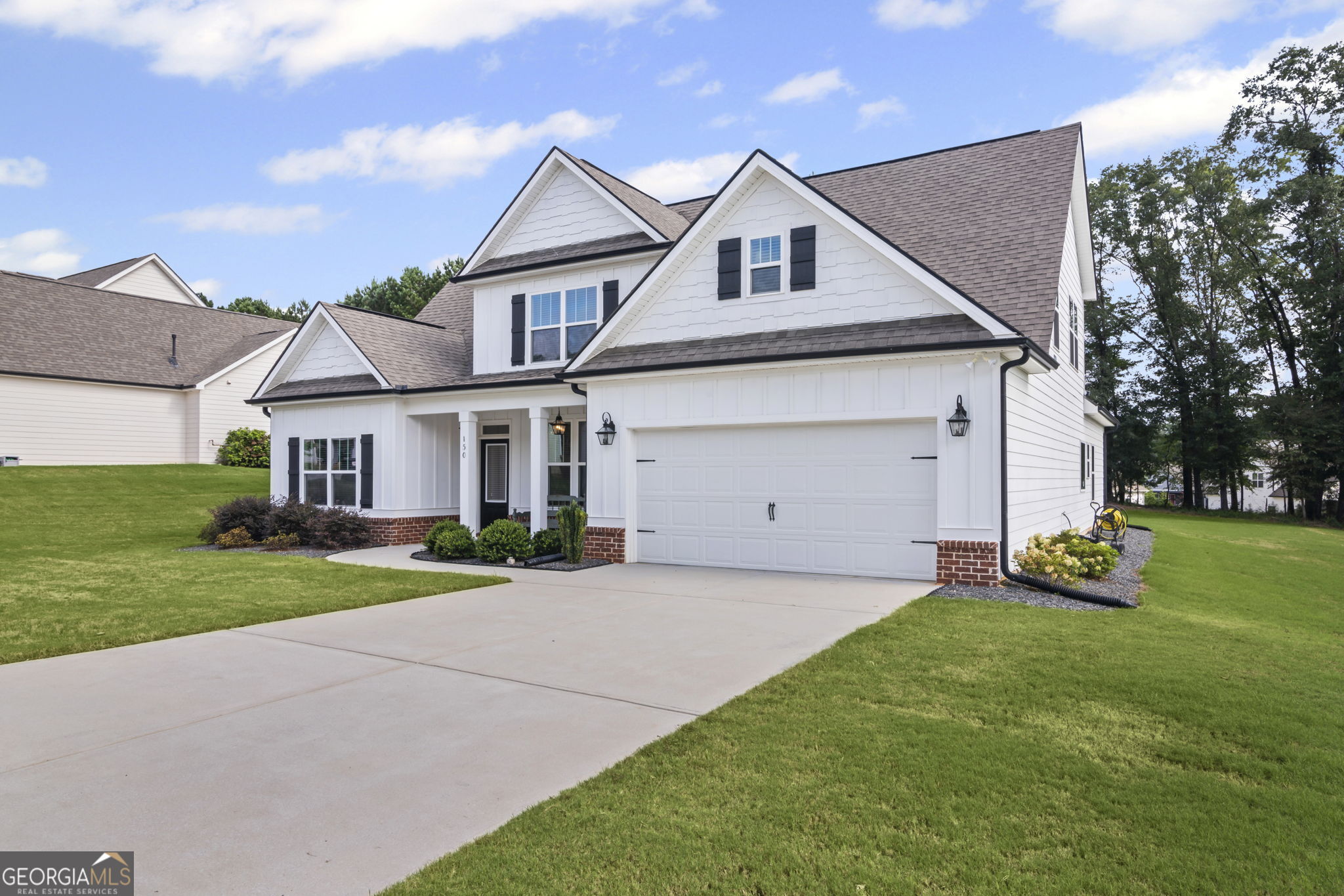 150 Duck Drive Senoia, GA 30276 - Photo 6 of 73 a front view of a house with a yard and garage