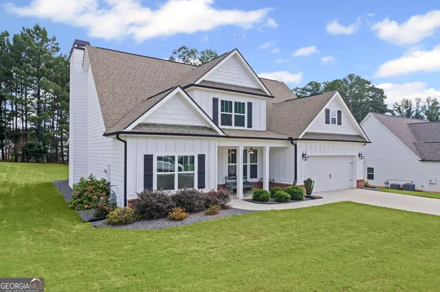 a view of a hallway with wooden floor windows and livingroom