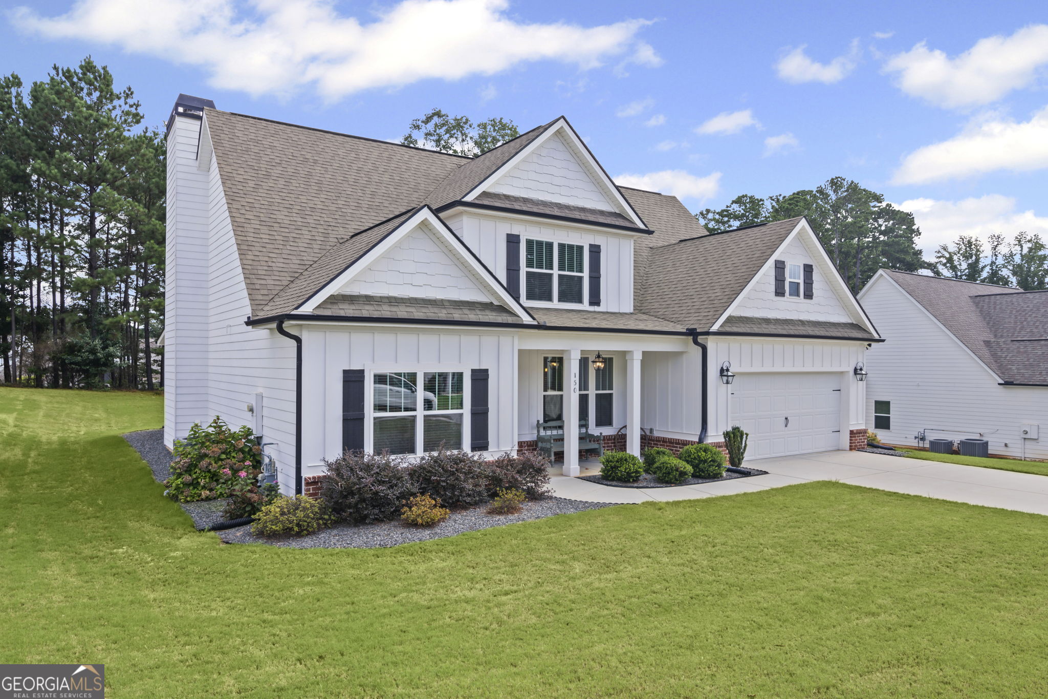150 Duck Drive Senoia, GA 30276 - Photo 7 of 73 a front view of a house with a garden and yard