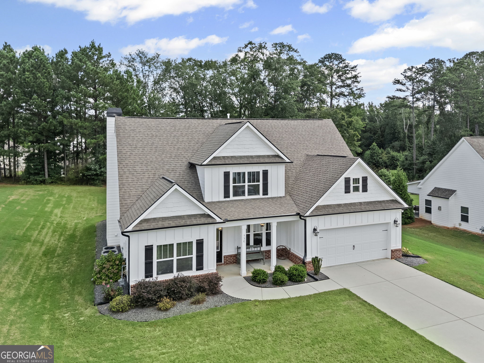 150 Duck Drive Senoia, GA 30276 - Photo 73 of 73 a view of house with garden and tall trees