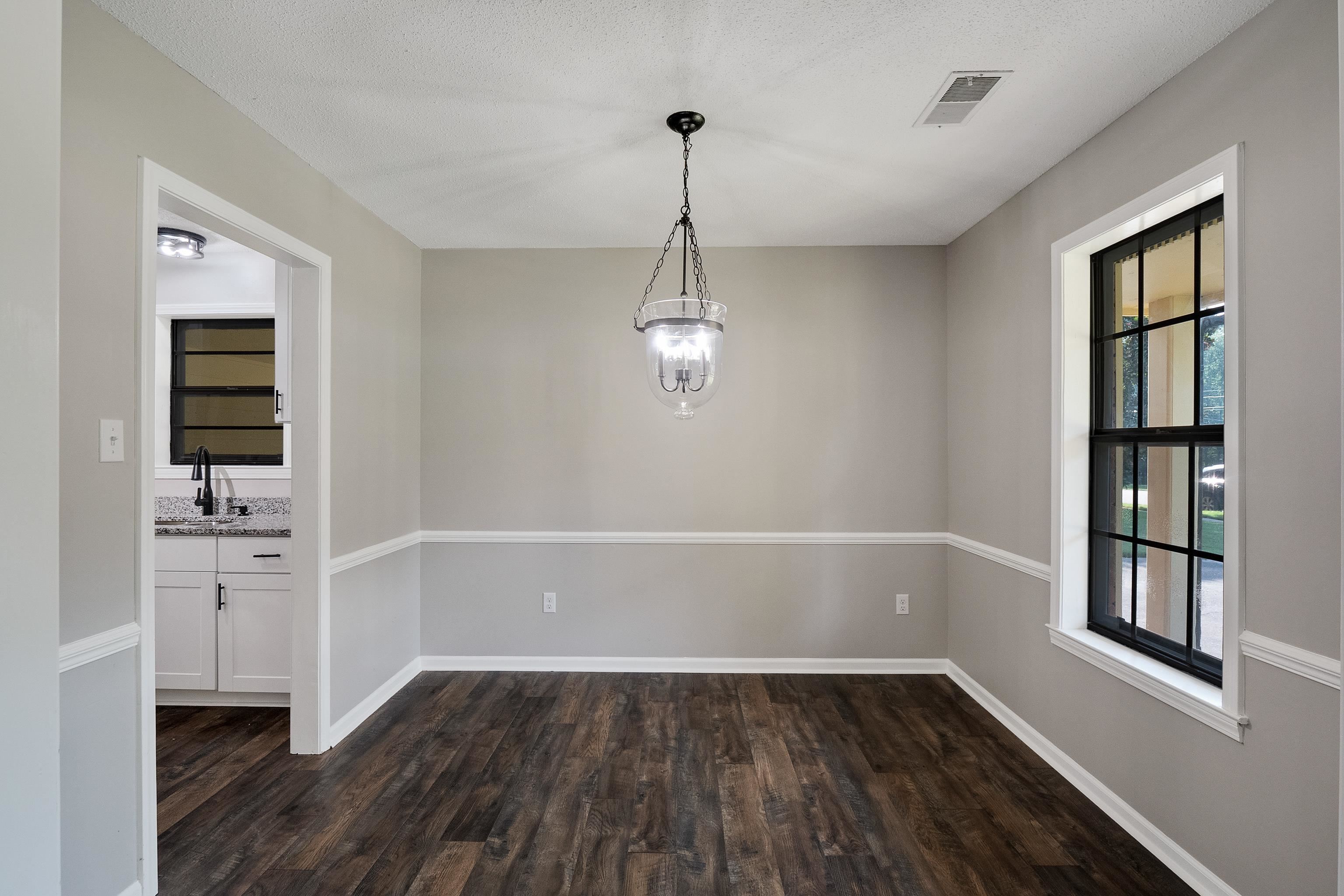 6384 Althorne Road Bartlett, TN 38134 - Photo 11 of 34 a view of empty room with wooden floor and windows