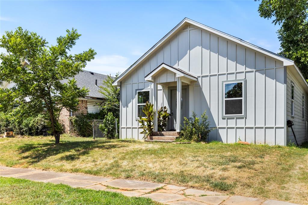 1127 West Morgan Street Denison, TX 75020 - Photo 14 of 23 a front view of a house with garden