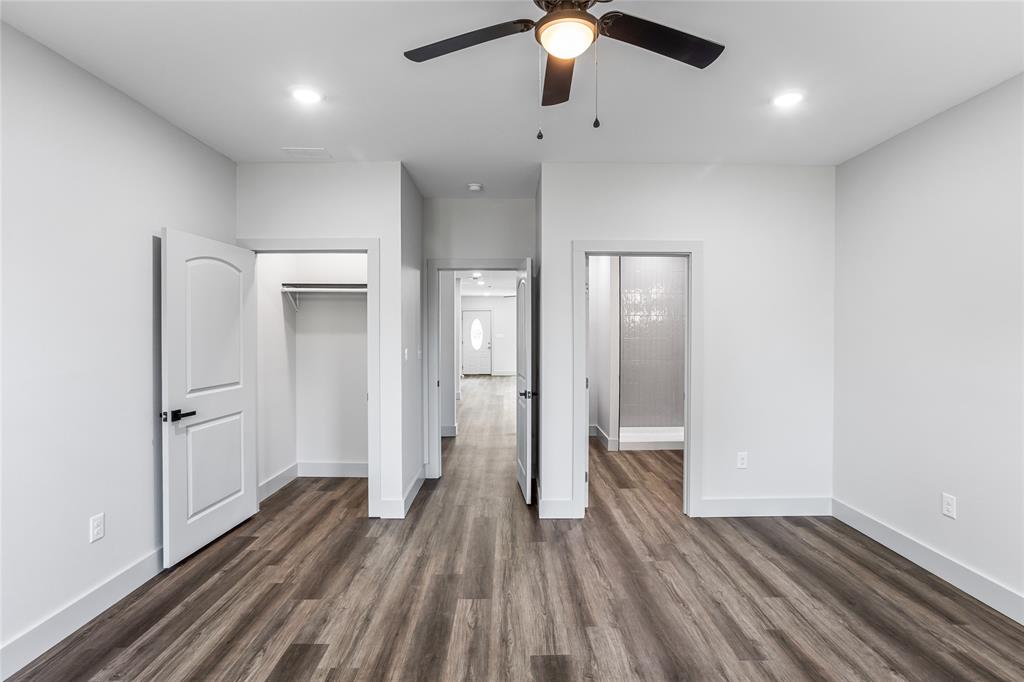 1127 West Morgan Street Denison, TX 75020 - Photo 19 of 23 wooden floor in an empty room with a window