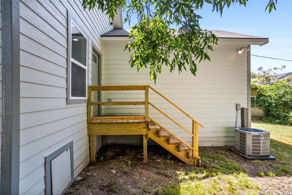 1127 West Morgan Street Denison, TX 75020 - Photo 21 of 23 a house view with a garden