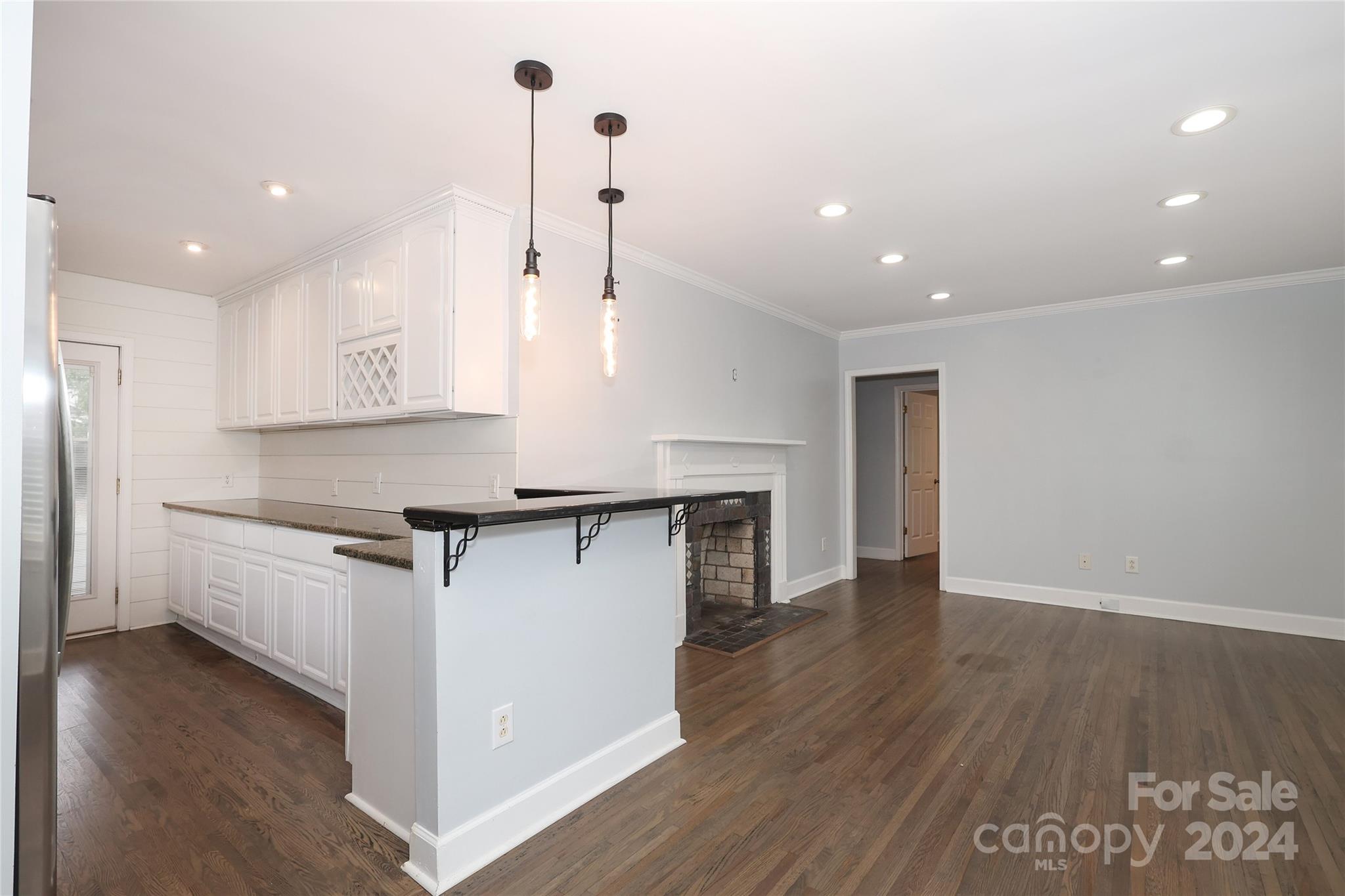 2012 Scott Avenue Charlotte, NC 28203 - Photo 12 of 43 a kitchen with stainless steel appliances granite countertop a refrigerator a sink and a stove