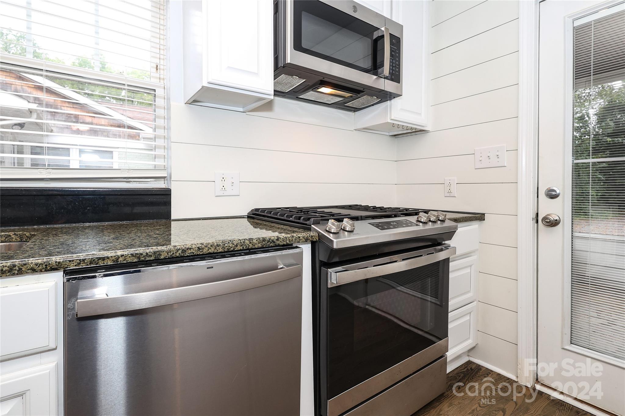 2012 Scott Avenue Charlotte, NC 28203 - Photo 16 of 43 a kitchen with a stove and a microwave