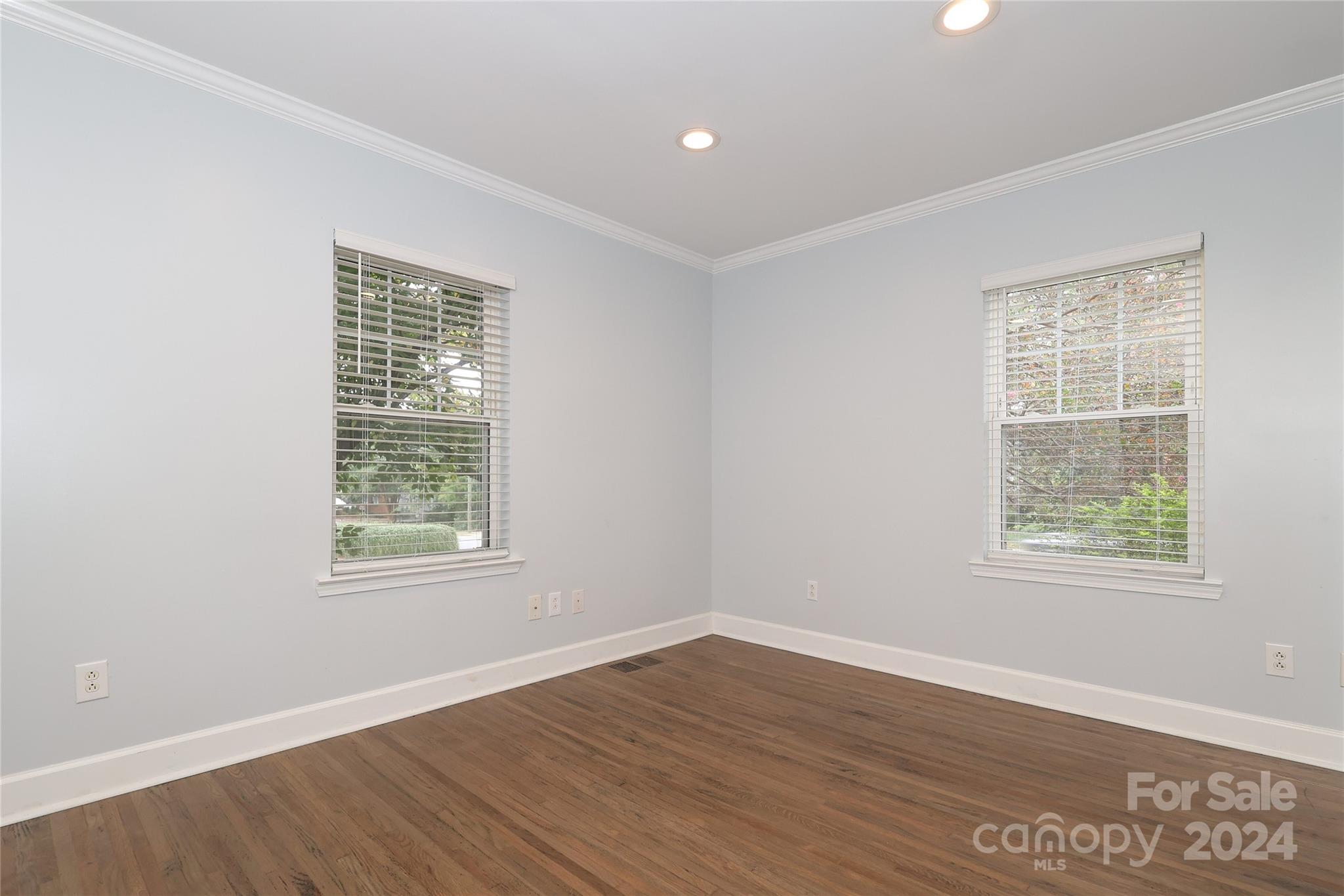 2012 Scott Avenue Charlotte, NC 28203 - Photo 18 of 43 an empty room with wooden floor and windows