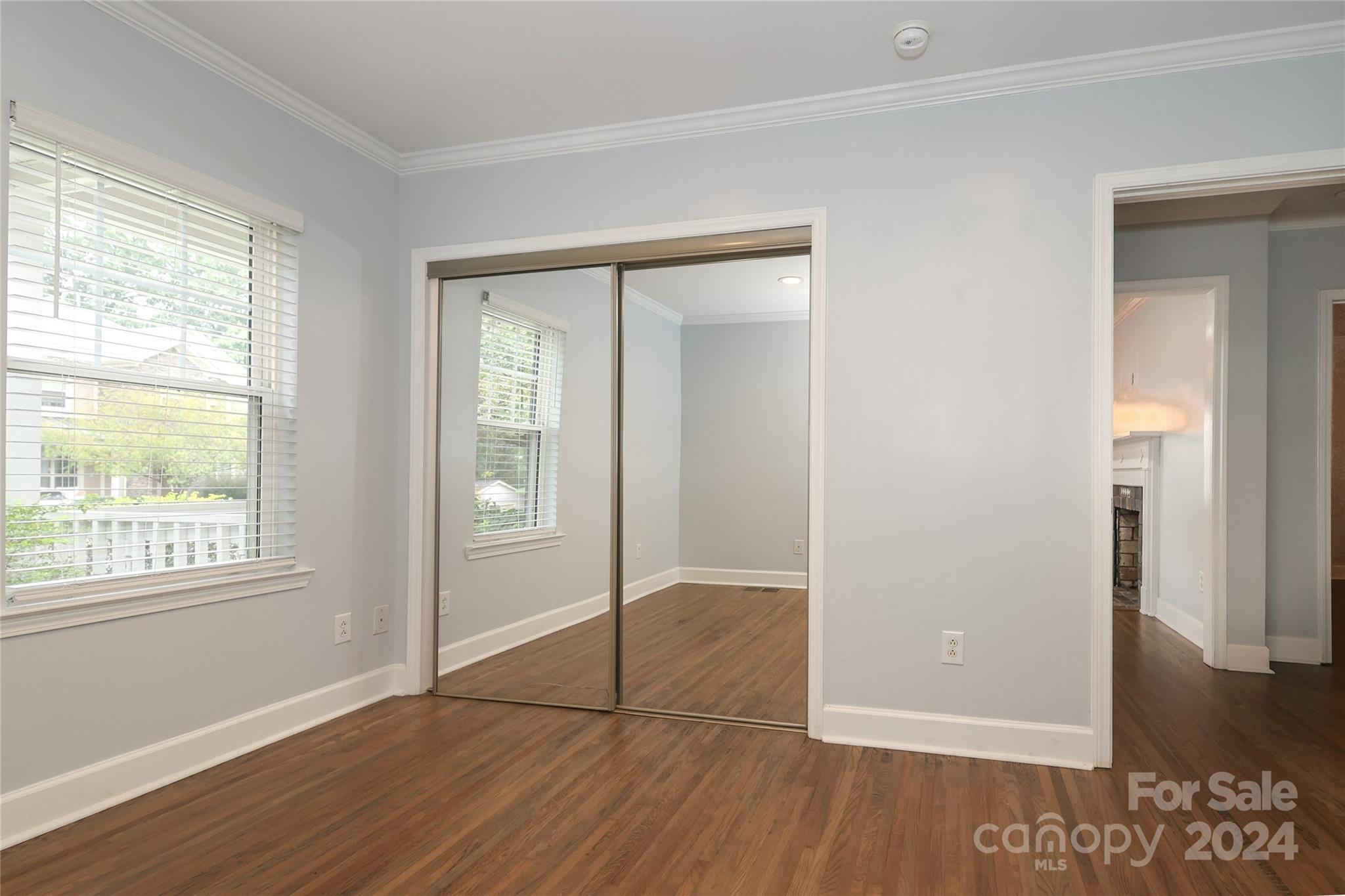2012 Scott Avenue Charlotte, NC 28203 - Photo 20 of 43 an empty room with wooden floor and windows