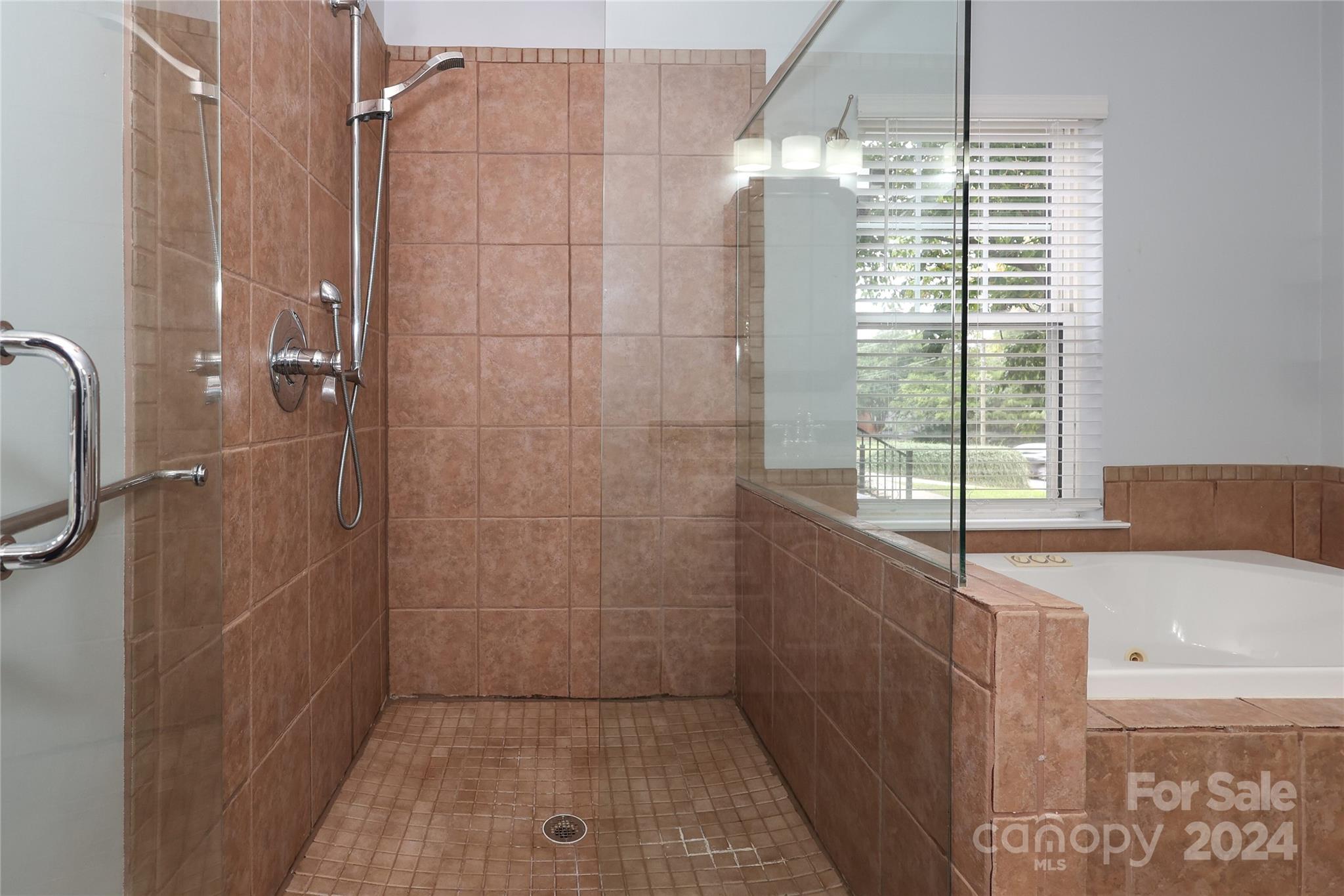 2012 Scott Avenue Charlotte, NC 28203 - Photo 30 of 43 a bathroom with a bathtub and shower