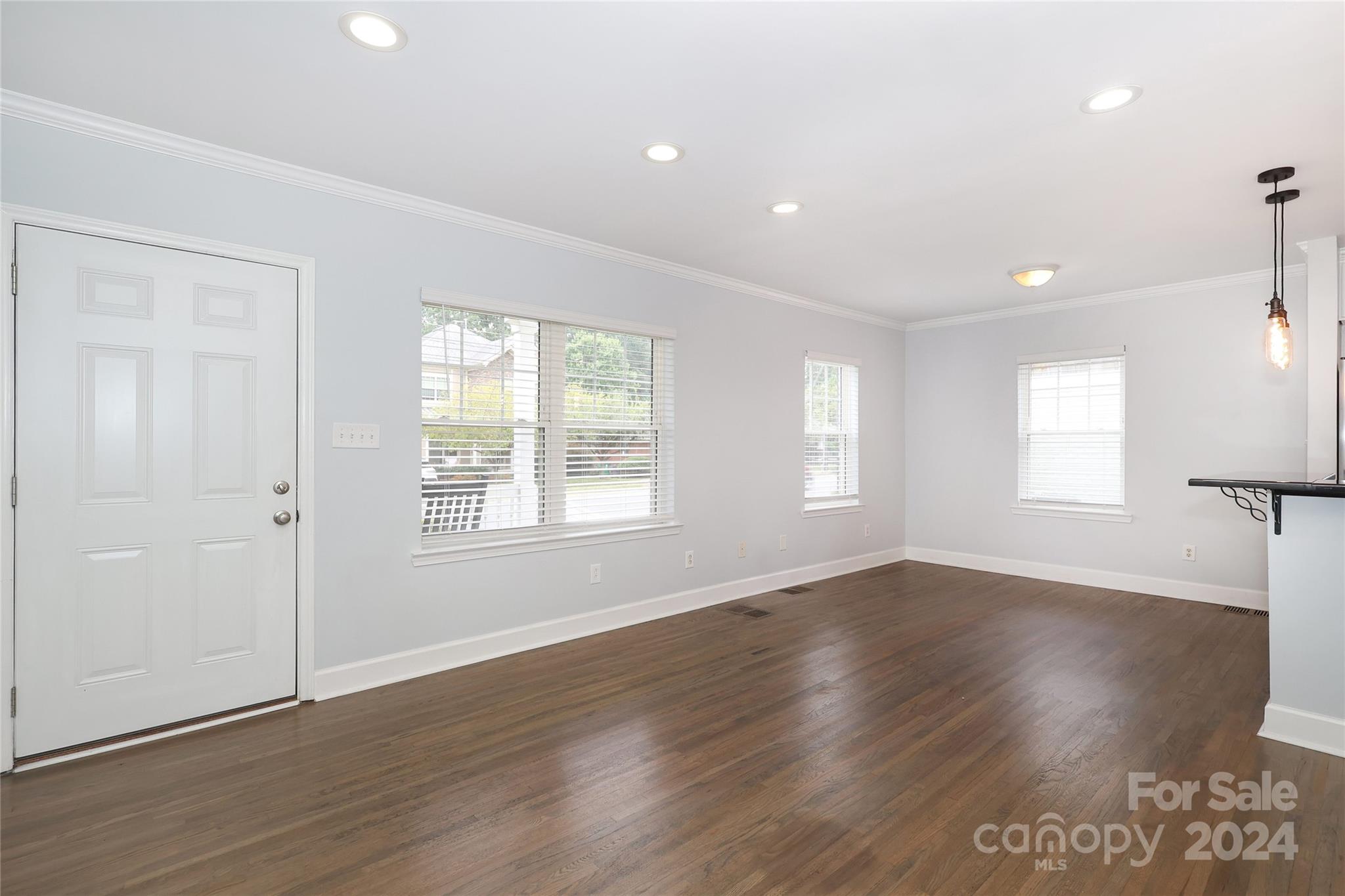 2012 Scott Avenue Charlotte, NC 28203 - Photo 5 of 43 an empty room with wooden floor and windows