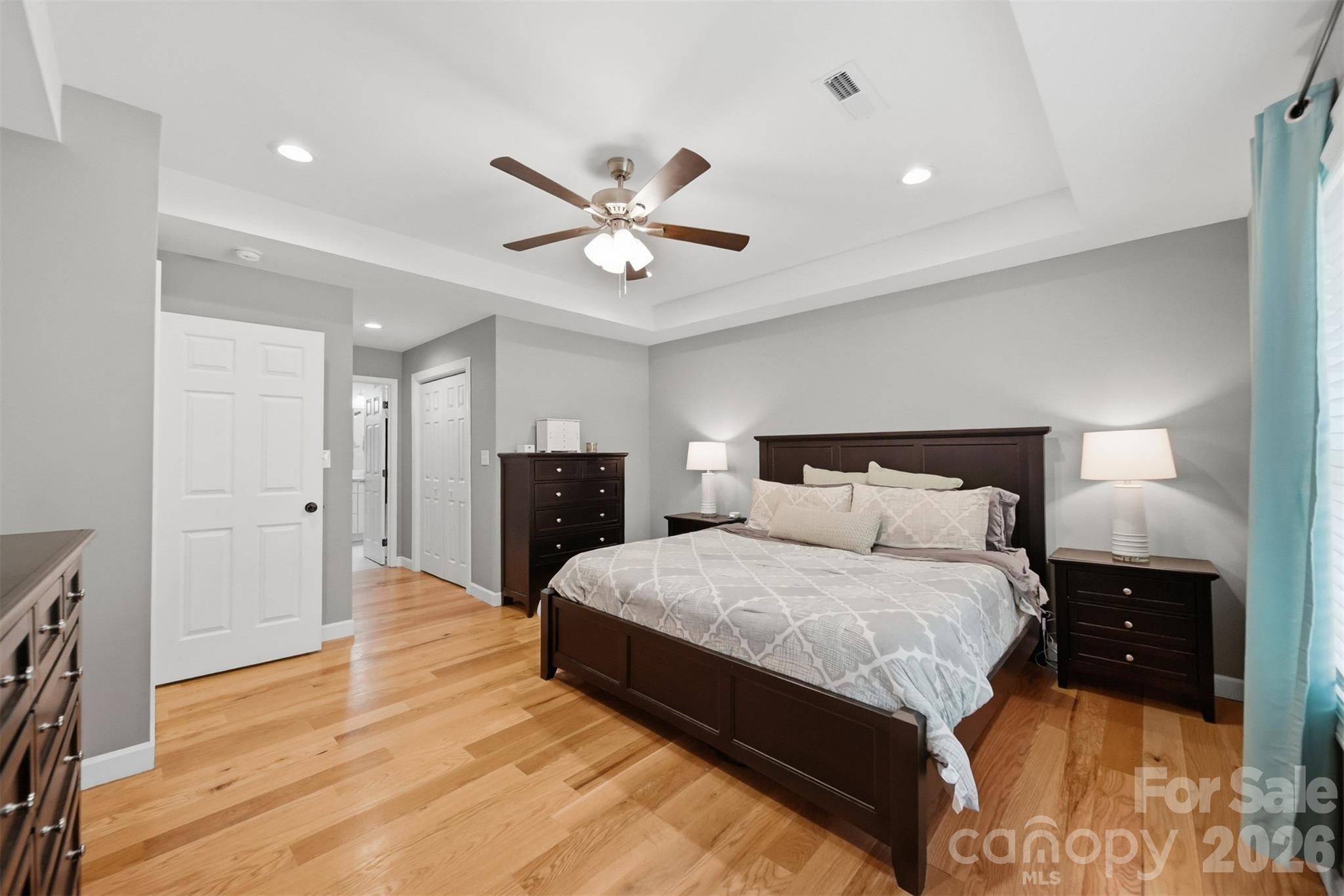 490 Dudley Shoals Road Granite Falls, NC 28630 - Photo 15 of 38 a bedroom with a bed and a chandelier