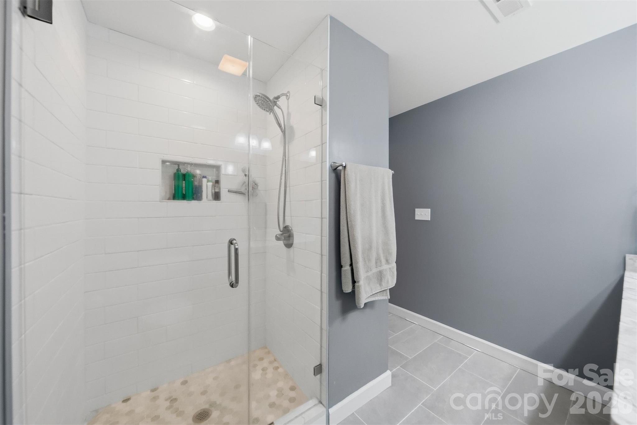 490 Dudley Shoals Road Granite Falls, NC 28630 - Photo 17 of 38 a bathroom with a sink and shower