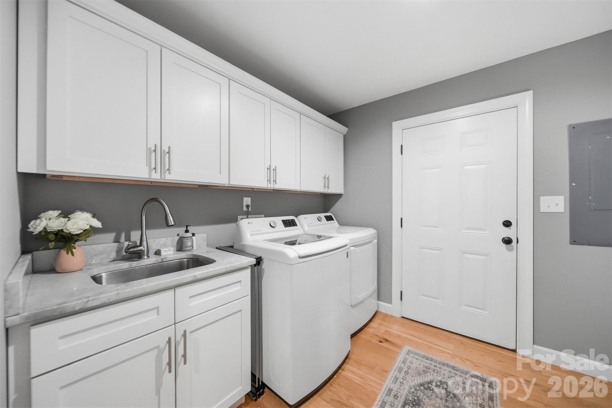 490 Dudley Shoals Road Granite Falls, NC 28630 - Photo 21 of 38 a view of cabinets a sink and a stove in a room