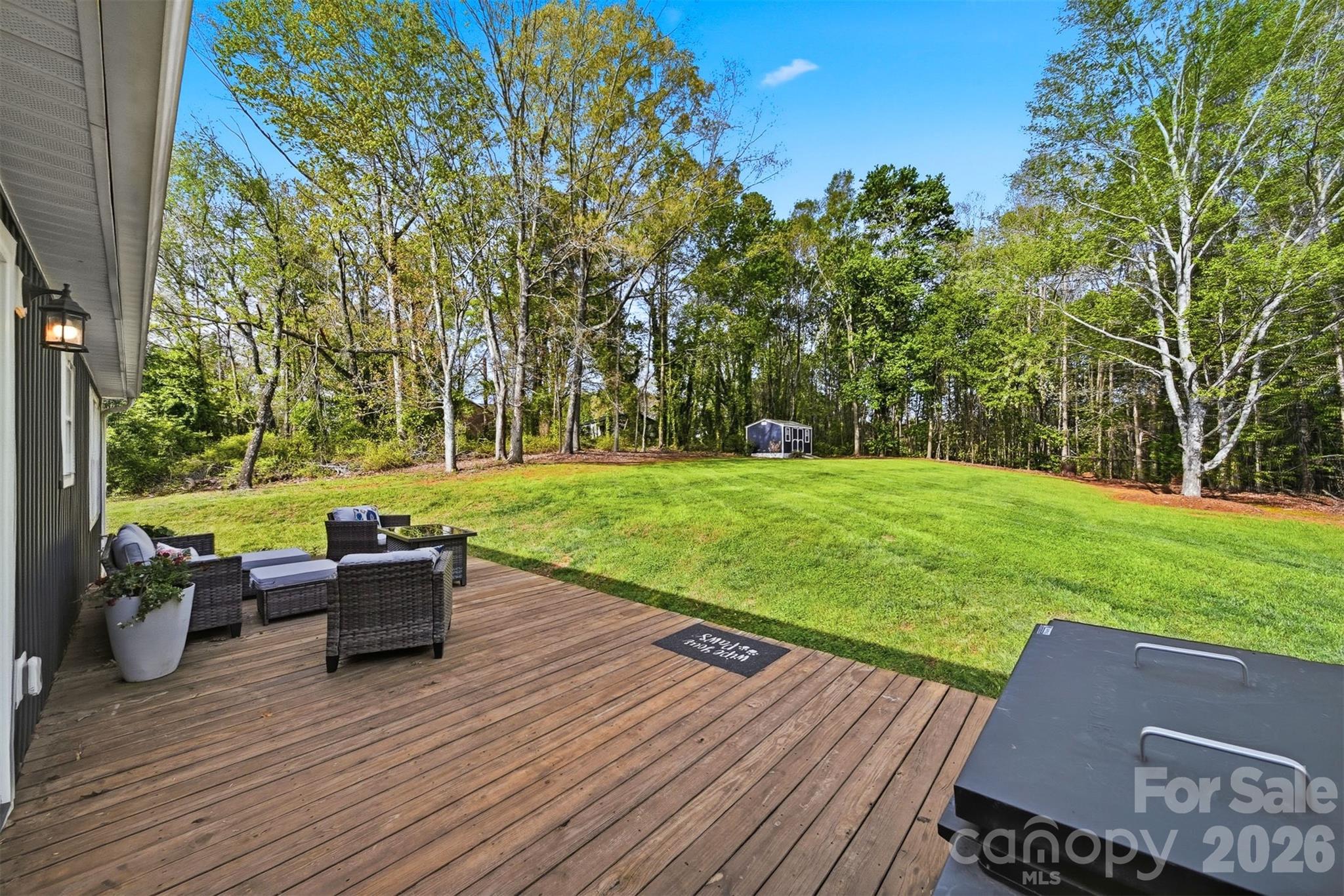 490 Dudley Shoals Road Granite Falls, NC 28630 - Photo 22 of 38 a backyard of a house with yard and outdoor seating