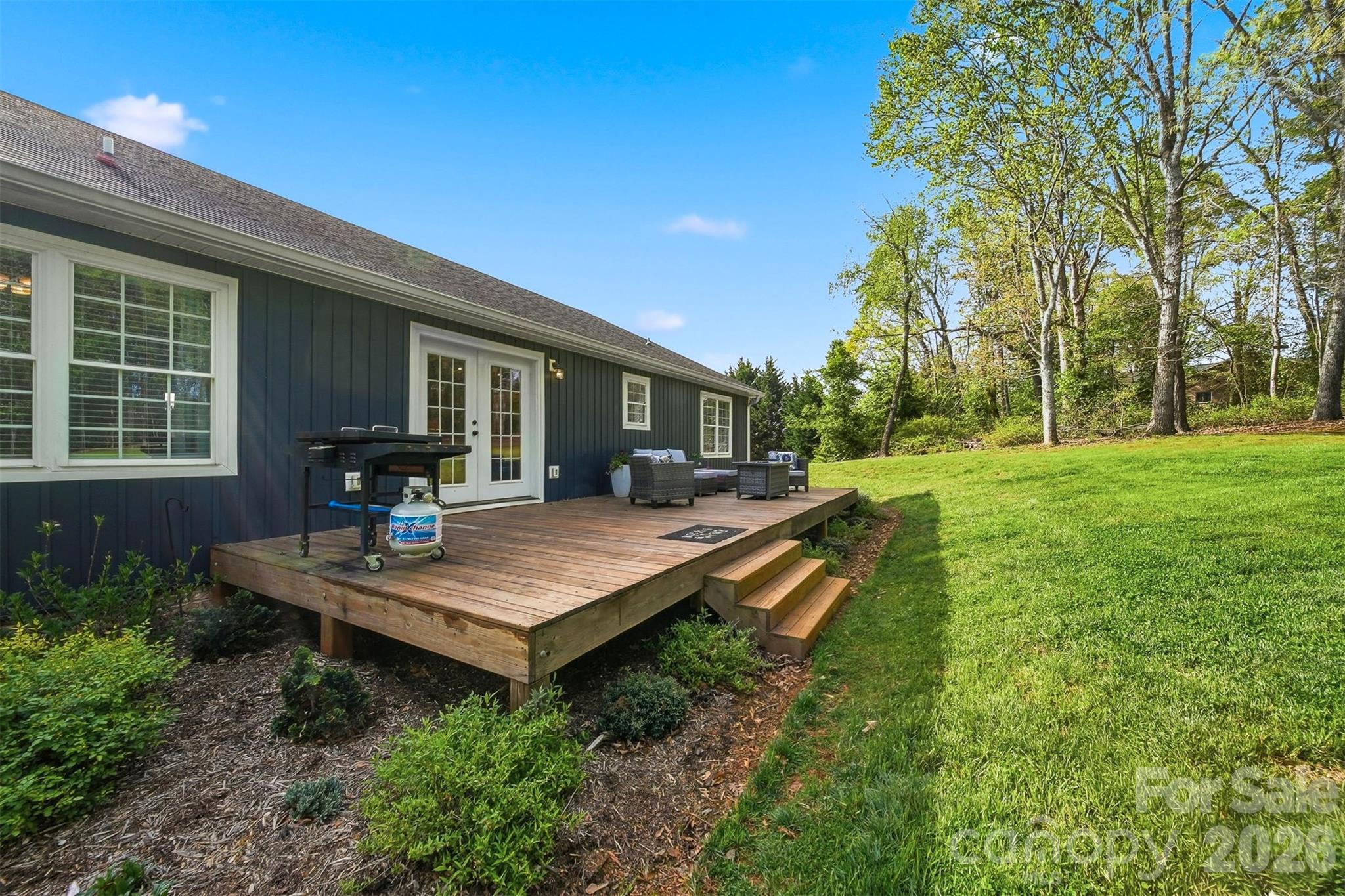 490 Dudley Shoals Road Granite Falls, NC 28630 - Photo 25 of 38 a view of a house with backyard and sitting area