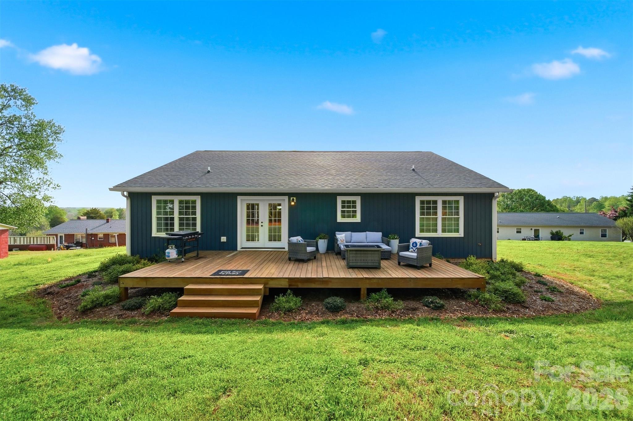 490 Dudley Shoals Road Granite Falls, NC 28630 - Photo 26 of 38 a view of a house with backyard porch and sitting area