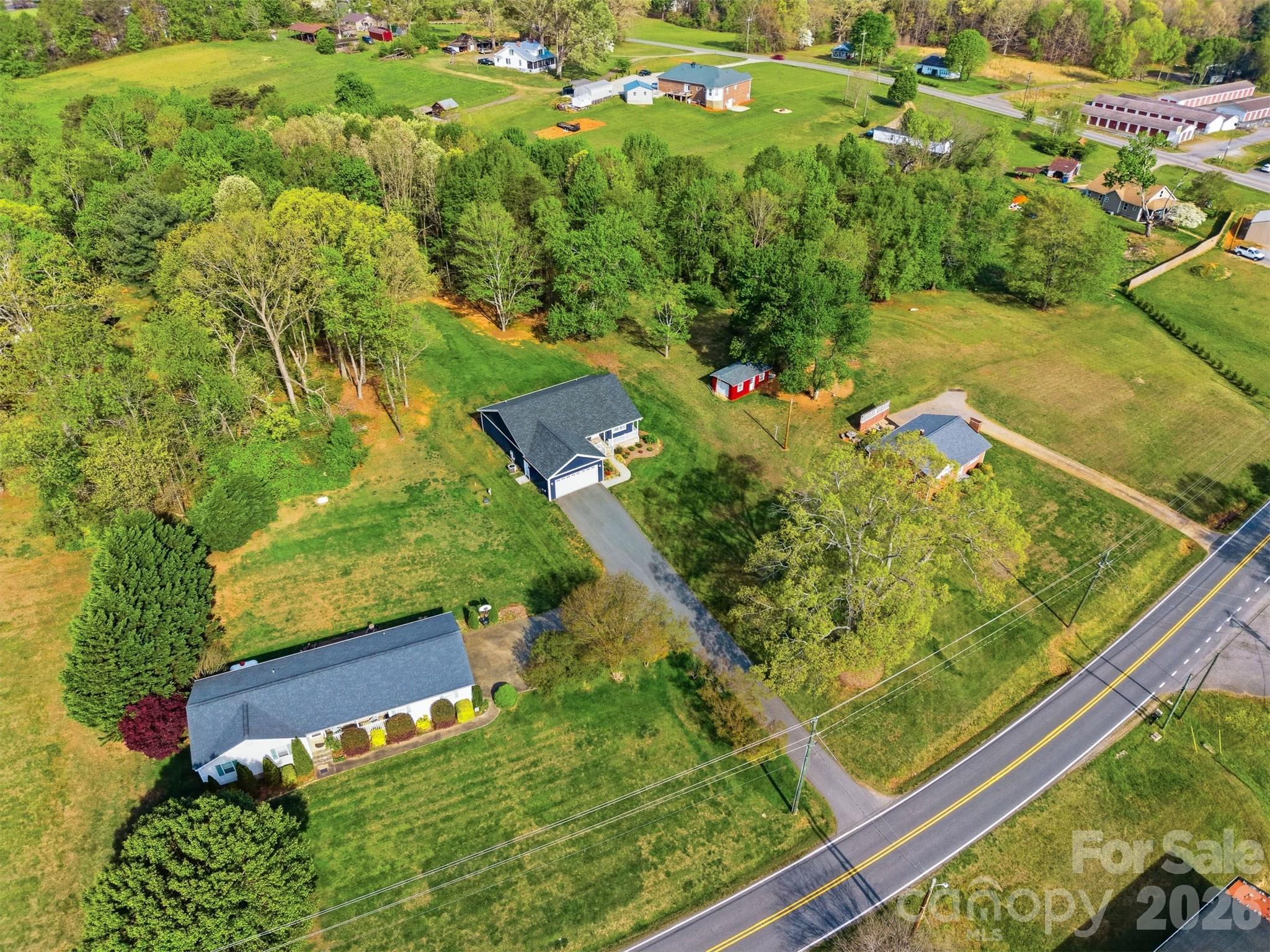 490 Dudley Shoals Road Granite Falls, NC 28630 - Photo 35 of 38 a view of a yard with plants