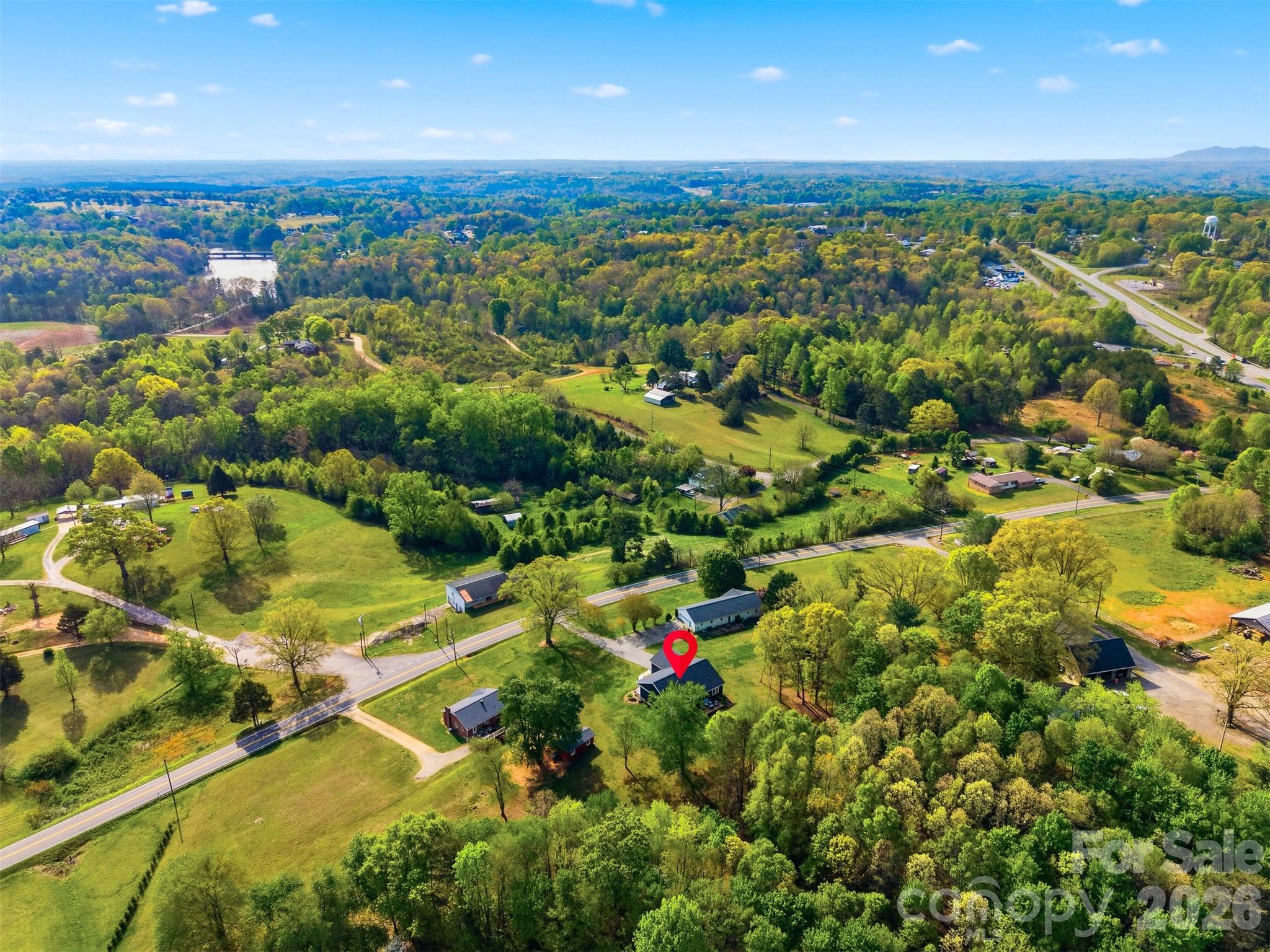 490 Dudley Shoals Road Granite Falls, NC 28630 - Photo 37 of 38 an aerial view of residential houses with outdoor space and trees