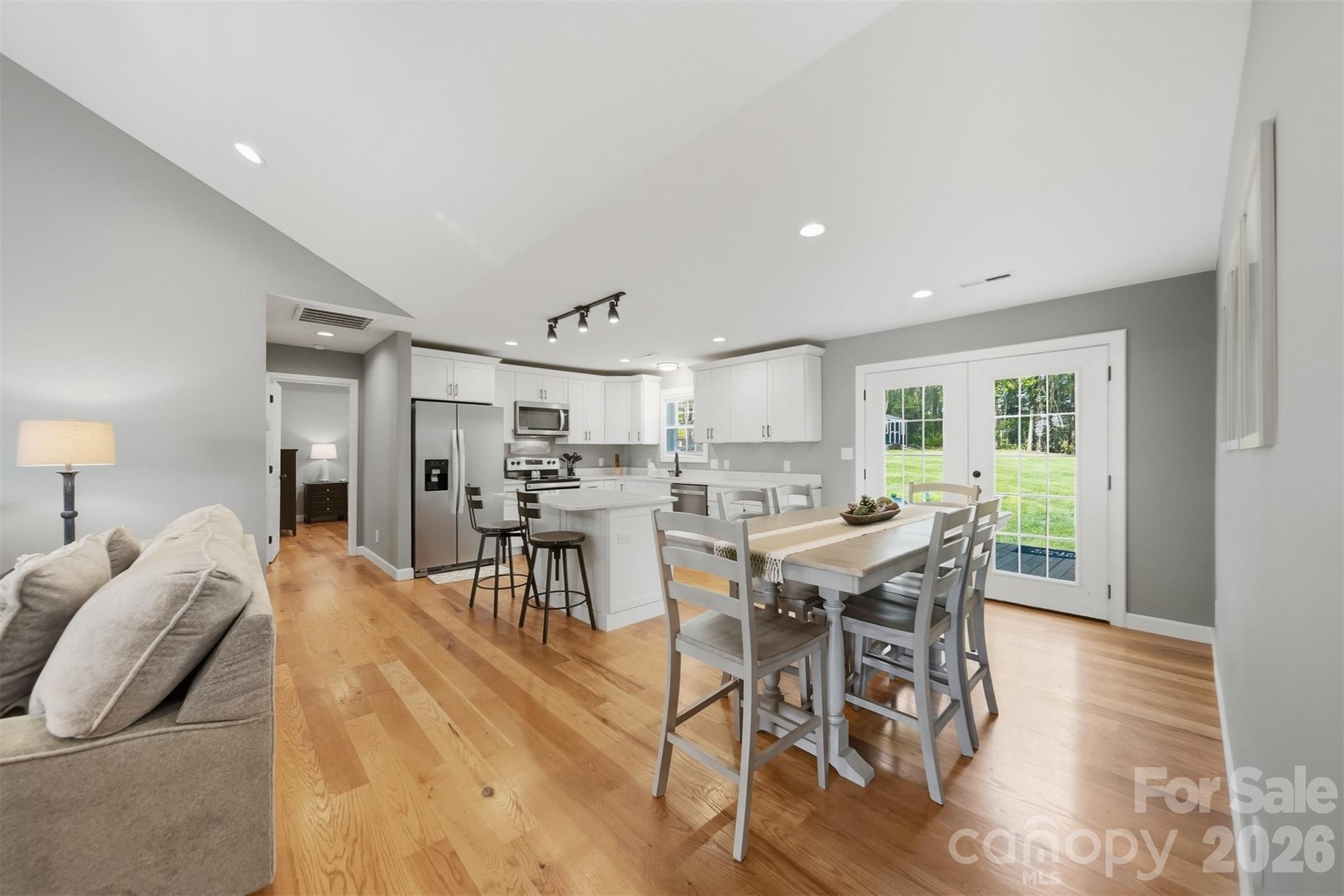 490 Dudley Shoals Road Granite Falls, NC 28630 - Photo 5 of 38 a view of a dining room with furniture and wooden floor