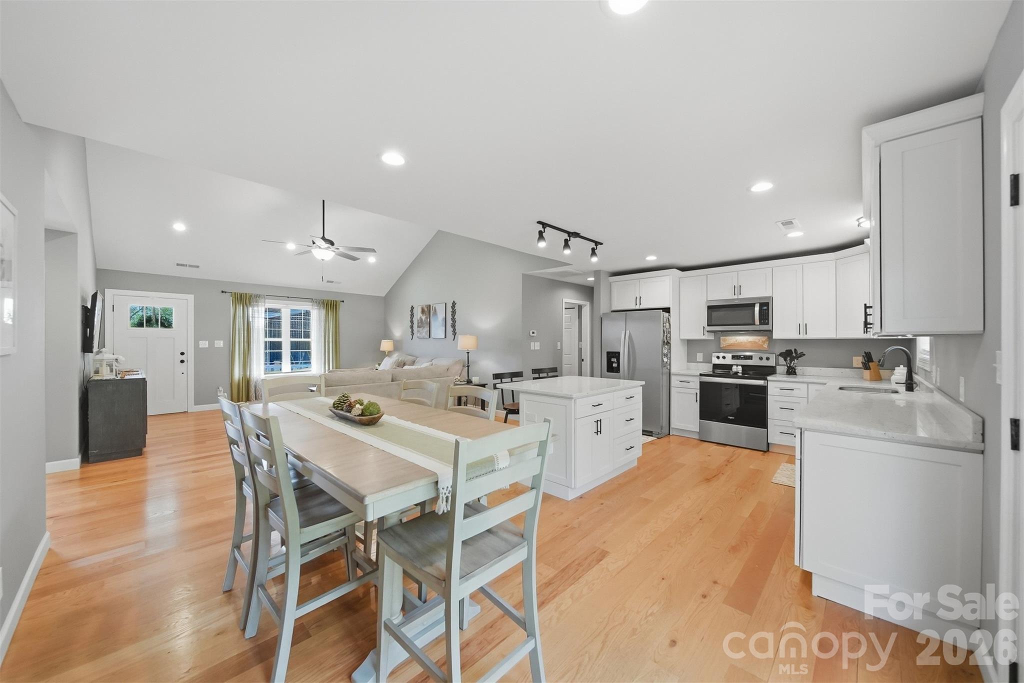 490 Dudley Shoals Road Granite Falls, NC 28630 - Photo 6 of 38 a large kitchen with a table and chairs