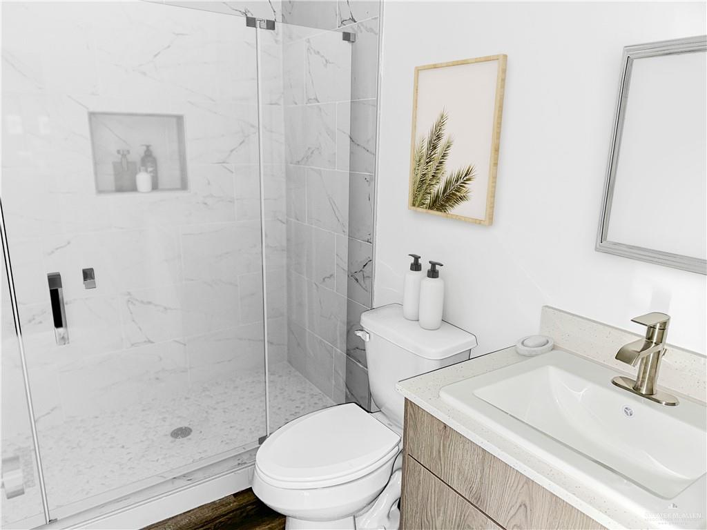 4905 Tyler, Unit 2 McAllen, TX 78503 - Photo 10 of 26 a bathroom with a sink toilet and shower
