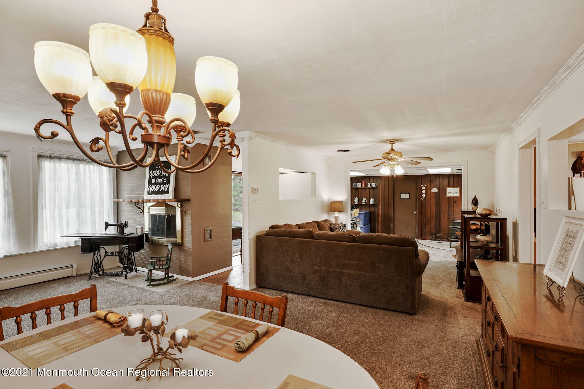 128 Hickory Road Jackson, NJ 08527 - Photo 11 of 25 a living room with furniture and flat screen tv