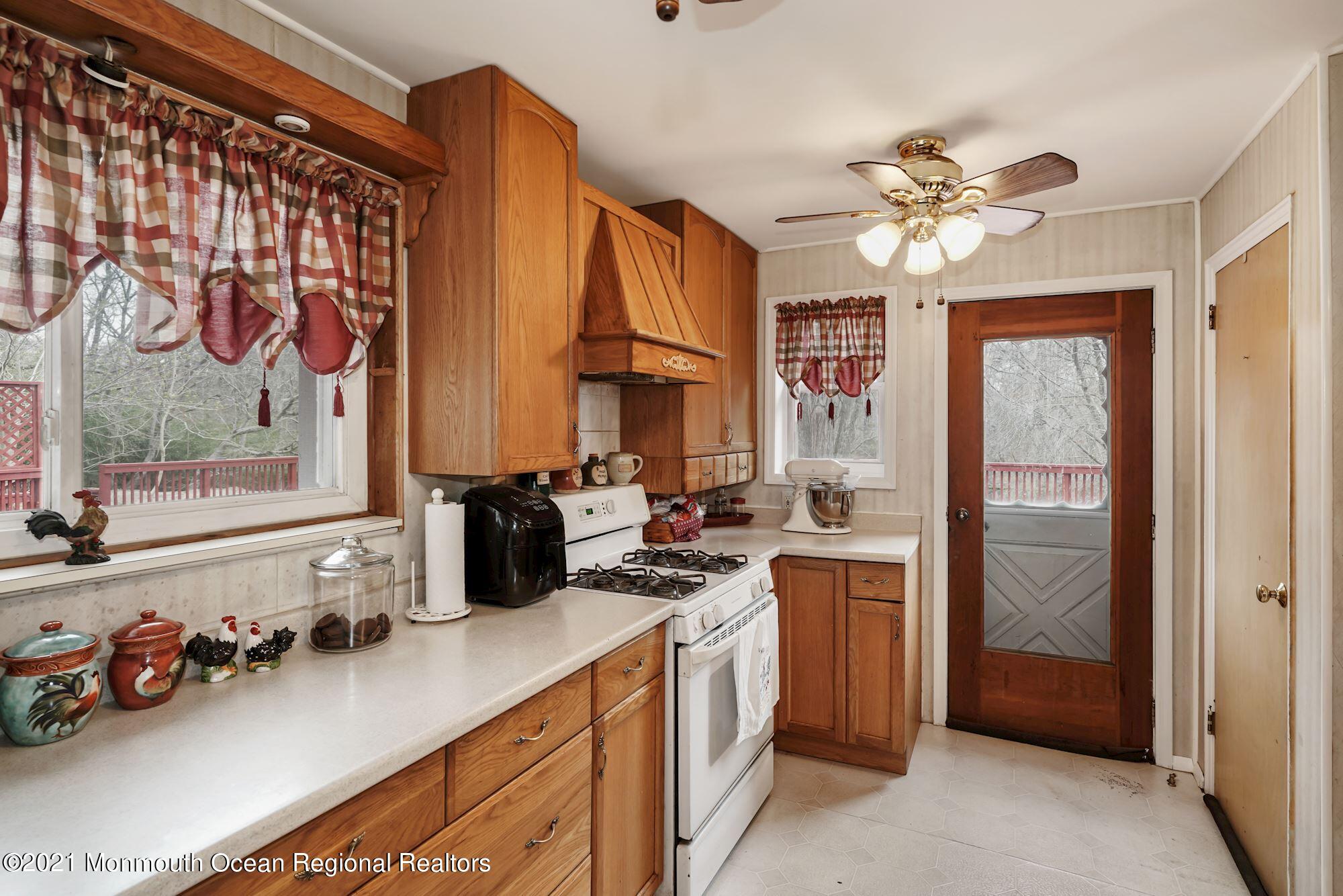 128 Hickory Road Jackson, NJ 08527 - Photo 16 of 25 a kitchen with a sink cabinets and window