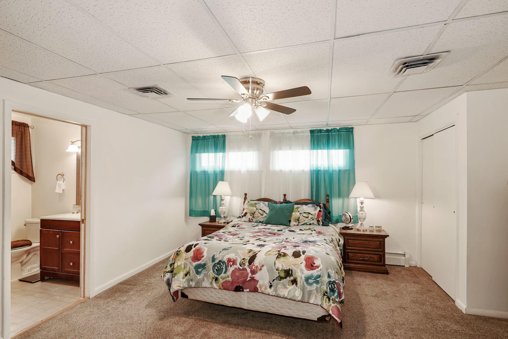 128 Hickory Road Jackson, NJ 08527 - Photo 19 of 25 a bedroom with a bed and window