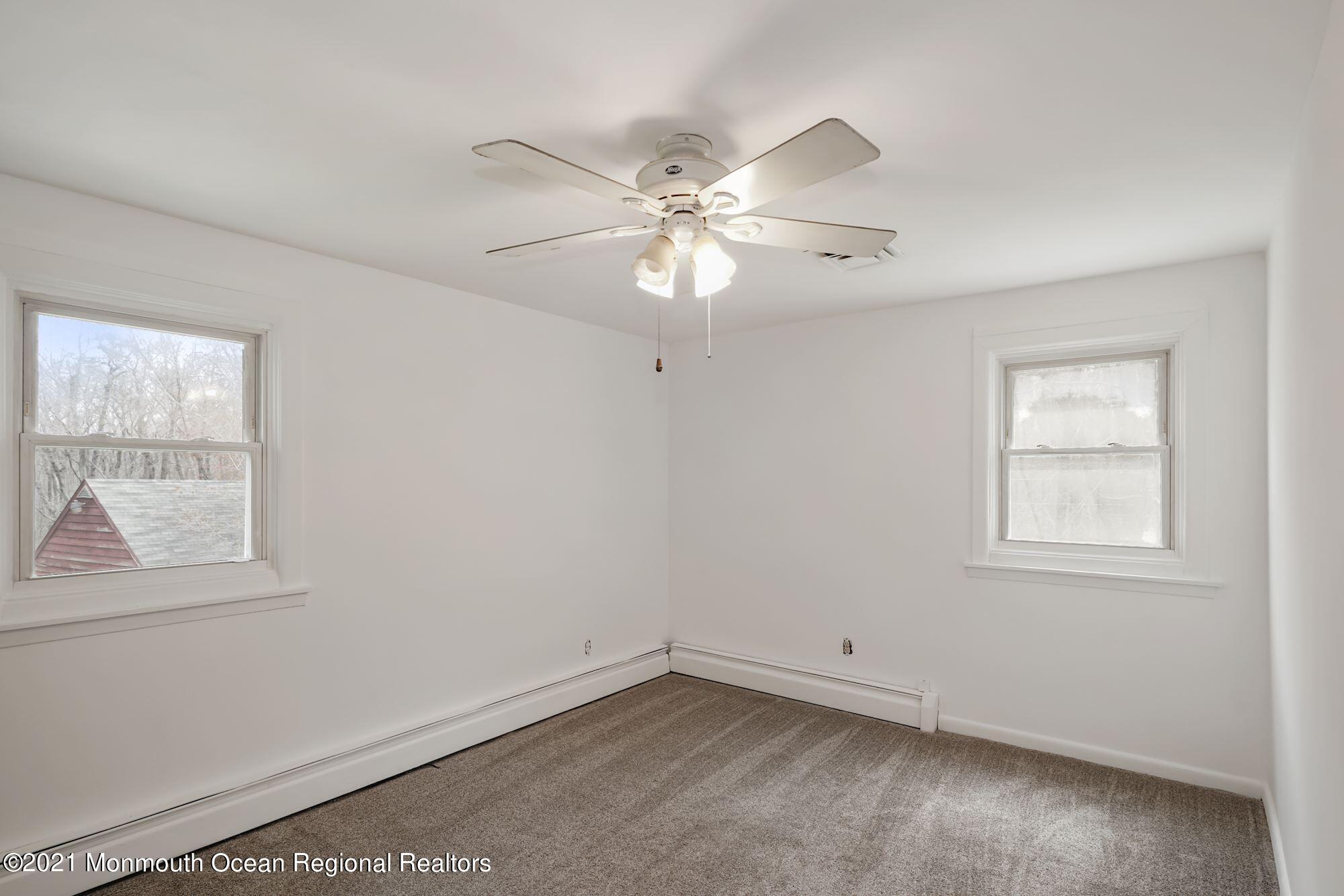 128 Hickory Road Jackson, NJ 08527 - Photo 23 of 25 a view of an empty room with a window