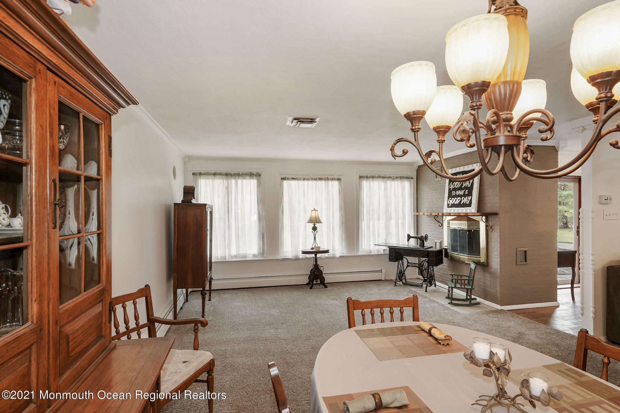 128 Hickory Road Jackson, NJ 08527 - Photo 9 of 25 a view of a livingroom with furniture and a window