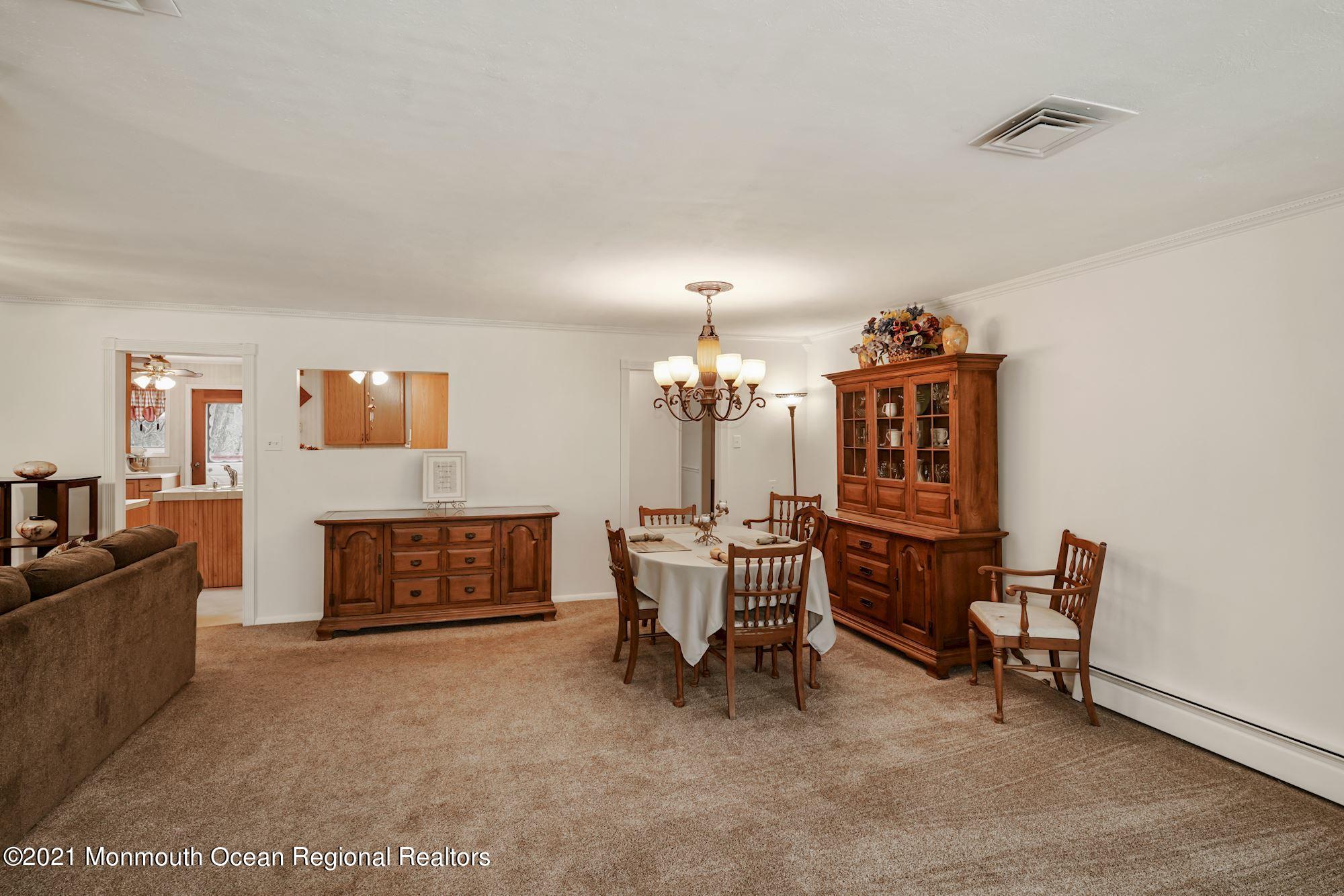 128 Hickory Road Jackson, NJ 08527 - Photo 10 of 25 a view of a livingroom with furniture and a fireplace